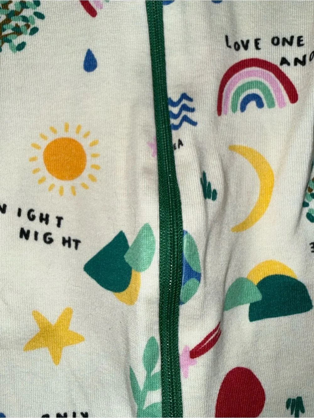 Hanna Andersson Cream Romper with Green Trim and Multicolor Prints